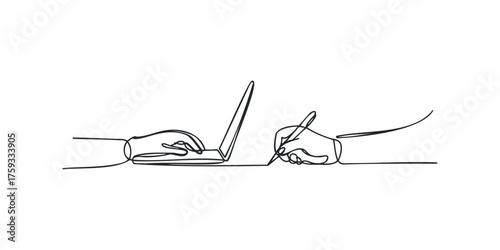 Person typing on laptop next to another person writing