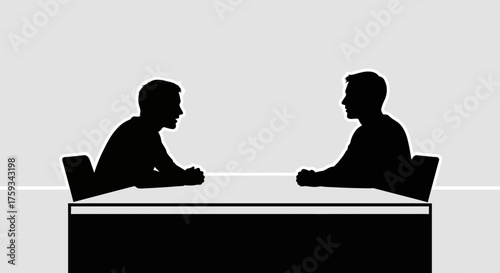 Two silhouetted figures facing each other across a table, engaged in discussion