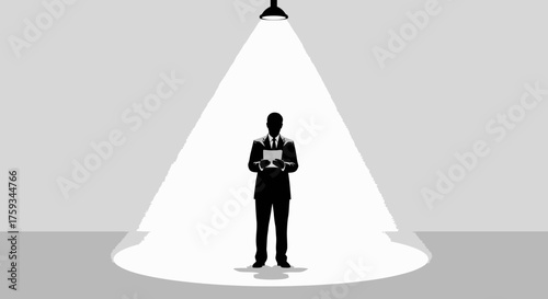 Silhouette of a man in a suit holding papers under a spotlight