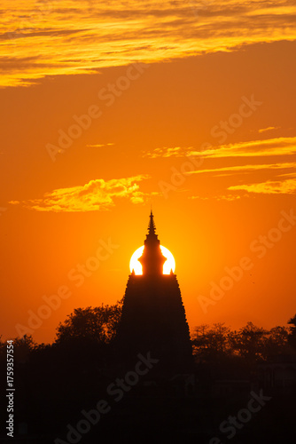 India, Bihar, Bodh Gaya, Beautiful Sunset over the  Sacred Mahabodhi Temple, Sun Going Down Align With Monuments.