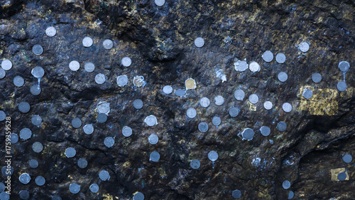 India, Bihar, Bodh Gaya, People Sticking Coins on Rock in Cave As Sacred Fate, Lord Buddha Meditation Cave Bodh Gaya.