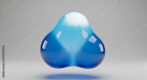 Abstract blue liquid shape with light reflections on a gray background, a modern design element with a smooth and glossy surface