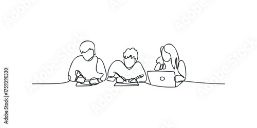 Three people working together at a table with a laptop and notebooks
