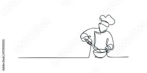 Chef stirring ingredients in a bowl using a whisk