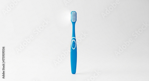 Closeup of a blue toothbrush, a common tool for maintaining oral hygiene and preventing dental problems