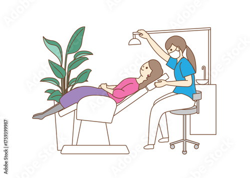 A woman receiving treatment on a dental clinic treatment table