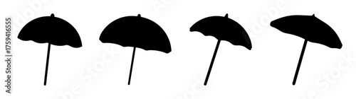 Row of four black beach umbrellas in silhouette against a plain background suggesting a seaside or outdoor setting