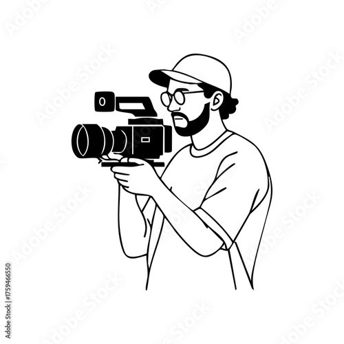 A man with glasses and cap holding a handheld camera, representing modern videography, freelance filmmaking, and content creation.