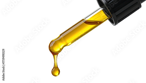 Dropper holding golden oil, ready to dispense