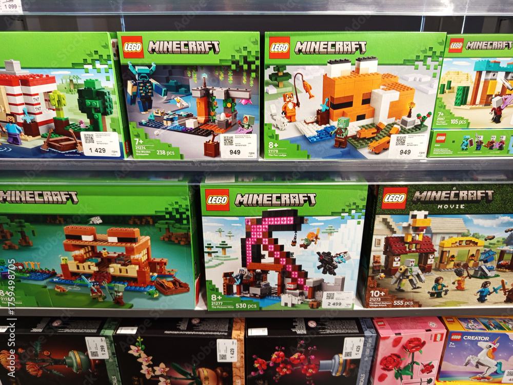 Naklejka premium Zvyagel, Ukraine - October 15, 2025: LEGO Minecraft building sets displayed on store shelf, showcasing various themes and characters, perfect for creative play and imaginative adventures