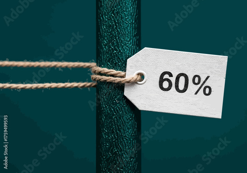 A tag reading 60 is tied with twine to a textured green pole against a deep teal background