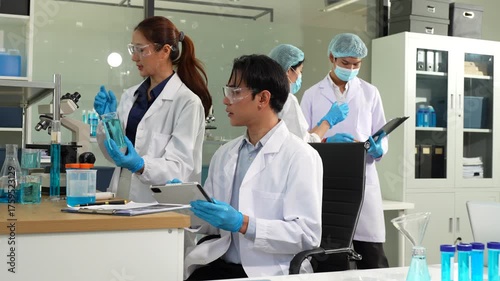 Scientists conducting research in a biotechnology lab, using pipettes and test tubes for medical and chemical experiments. Innovation in chemistry, healthcare, and medicine.