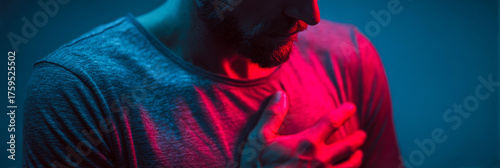 Man experiencing heart problems in emergency situation while feeling chest pain at night