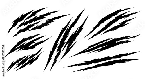 A collection of various black monster claw scratches. Aggressive vector icons of slash marks creating a torn, ripped, or damaged surface effect.