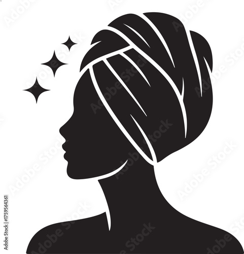 Silhouette of a woman with a towel wrapped around her head