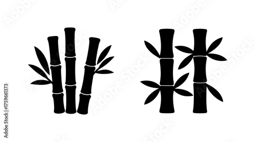 Two stylized silhouettes of bamboo stalks with leaves for natural asian themed designs