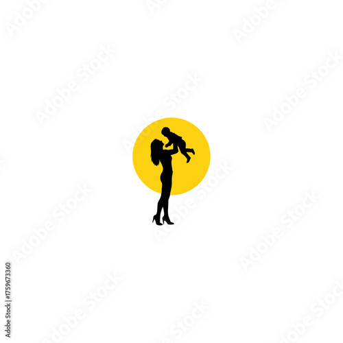 Mother holding her baby up in the air with joy.