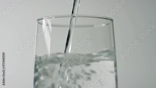 pouring water into glass