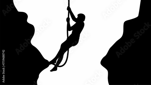 Dynamic silhouette shows daring climber rappelling down steep cliff face with rope for extreme adventure