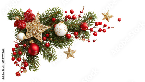 A corner decoration of pine branches with red berries and festive ornaments for Christmas holiday isolated on white background
