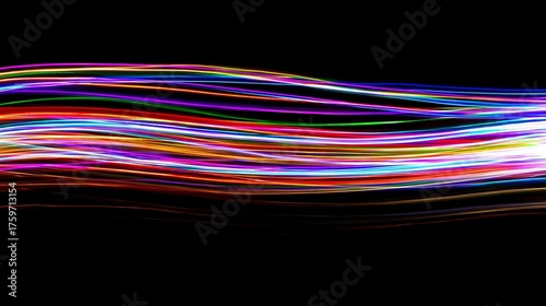 A mesmerizing display of light trails against a dark background, showcasing a vibrant array of colors blending seamlessly to create a dynamic and abstract visual effect, perfect for modern art © Asad