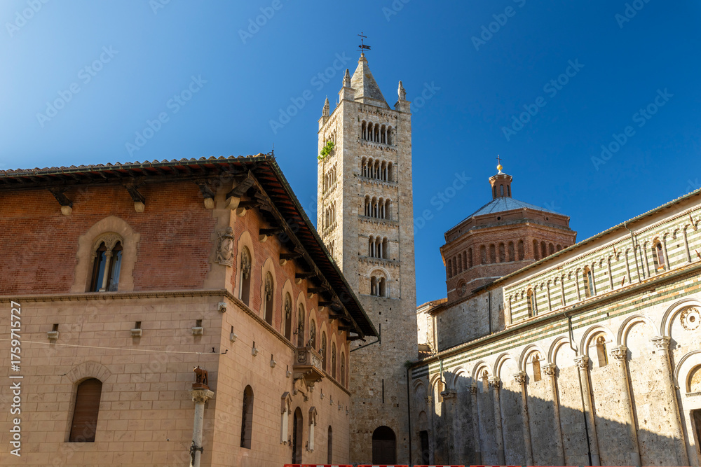 Obraz premium Massa Marittima Duomo bell tower and historic buildings