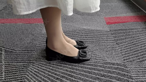Tapping Toes in Black Shoes: Thoughtful, Anxious Waiting
