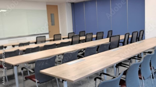 Blurry comfy view workplace,blur background,A vacant or available meeting room equipped with a large table and a projector.