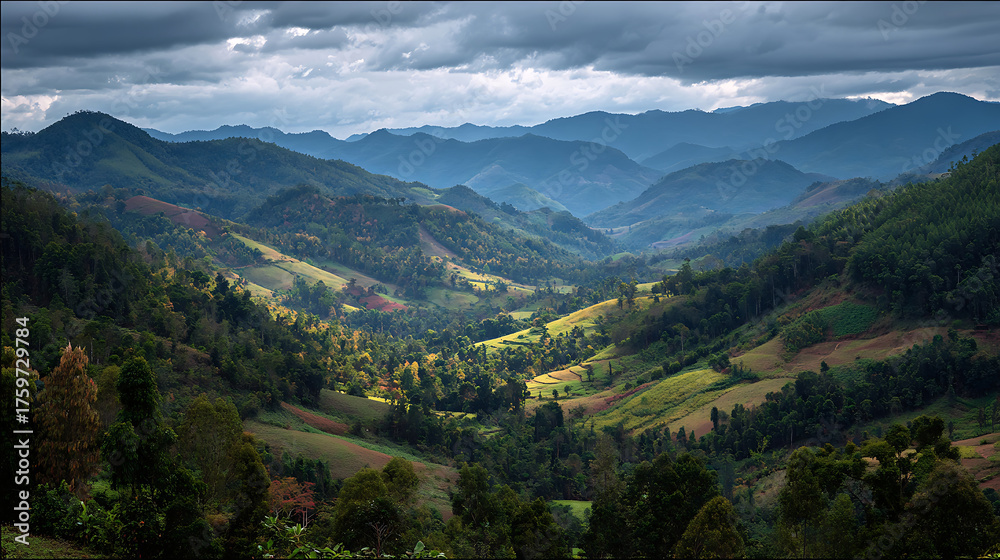 Naklejka premium Verdant layered hills with wispy clouds in Thailand Mae Hong Son, showing a beautiful natural landscape.