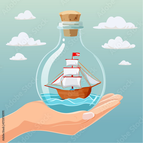 Sailboat in a bottle held by a hand