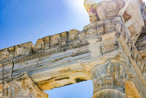 Ancient Stone Architecture Showcasing Intricate Details and Carvings in a Clear Sky Background