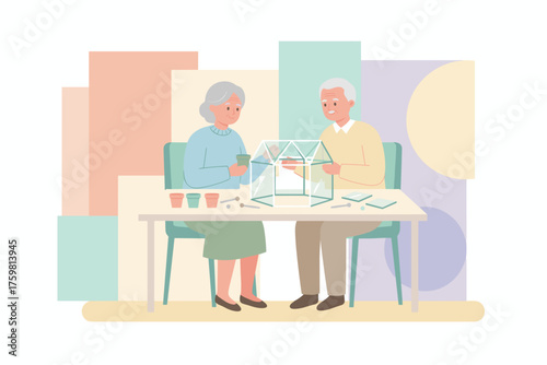 Happy senior couple building a terrarium together enjoying a creative hobby at home