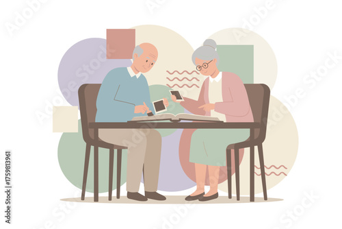 Elderly couple organizing old photos into an album reminiscing about precious memories together
