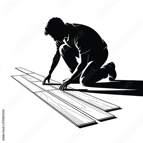 Silhouette of a person installing wooden floor planks