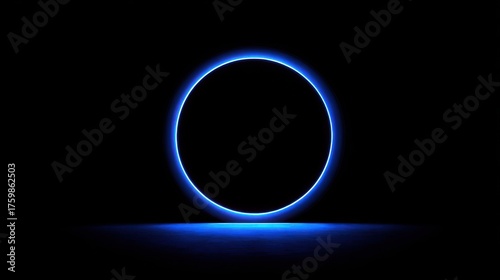 Glowing blue neon circle on a dark background with reflection