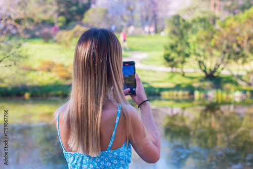 young woman taking a picture of themselves