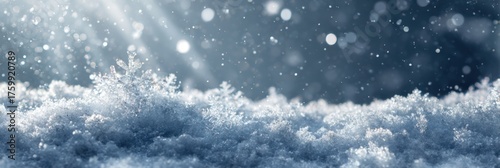 Snowflakes on snow bed receiving sunbeams while snowing