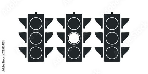 Three traffic lights aligned horizontally with one illuminated light