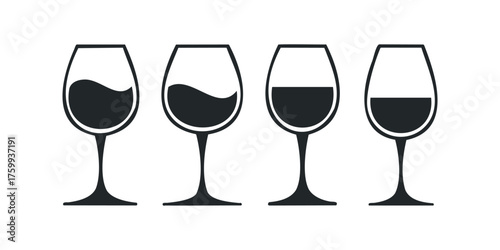 Four wine glasses with varying fill levels