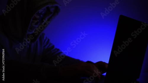 hacker at laptop hacking programs