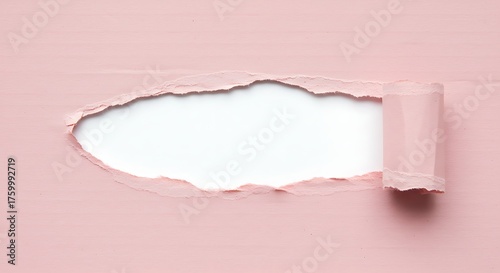 Torn pink paper revealing blank space for message or design concept