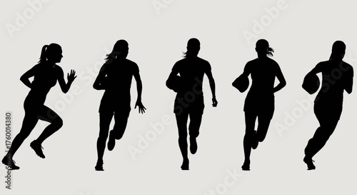 Silhouette of female rugby players running with ball