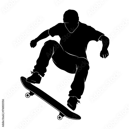 Silhouette of a young male skateboarder performing a trick