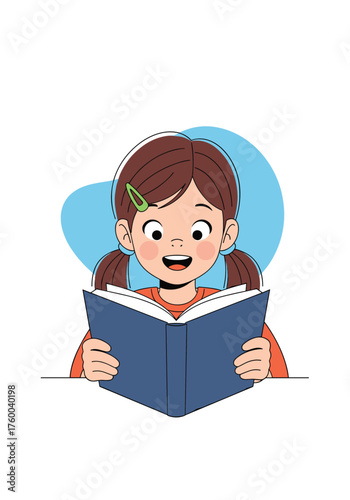 A young girl with pigtails happily reads an open book wearing an orange shirt.