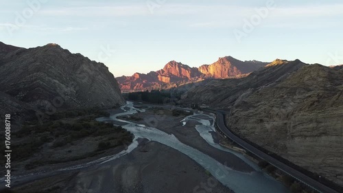 drone shot of sunrise over mountains in tianshan grand canyon, xinjiang, china