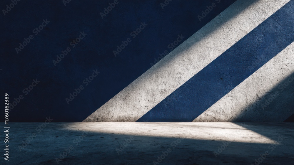 Fototapeta premium Abstract composition of light and shadows on textured blue wall.