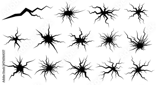 A collection of black cracks radiating outwards from a central point representing geological fractures or impact damage.