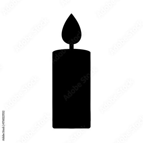 burning candle on black background