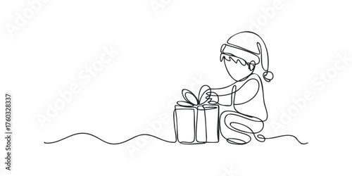 Child wearing Santa hat tying a gift box