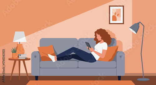 Young woman relaxing on sofa using tablet in cozy living room with warm color palette. Concept for online learning, home entertainment and interior design presentation.